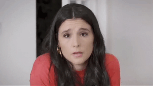 Woman In Red Shirt Making Funny Face GIF