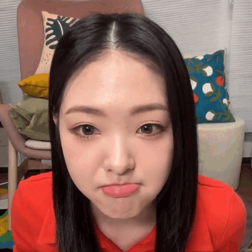 Woman In Red Shirt Making Funny Face GIF