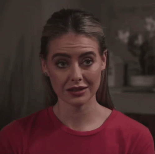 Woman In Red Shirt Making Silly Face GIF