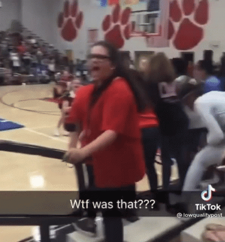 Woman in Red Shirt on Basketball Court