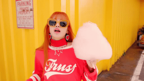 Woman in Red Shirt Saying Trust Holding Cotton Candy