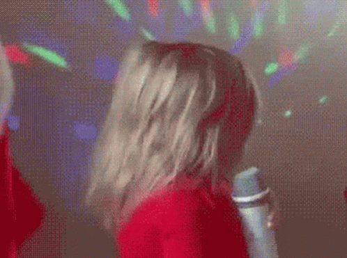 Woman in Red Shirt Singing
