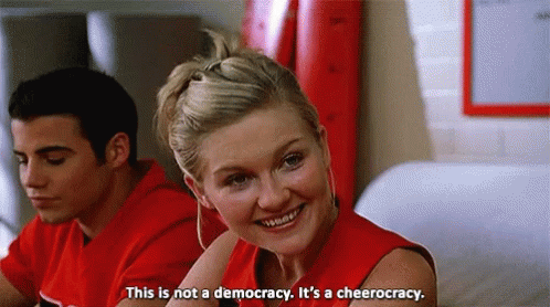 Woman In Red Shirt This Is Not A Democracy It's A Cheerleading GIF