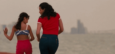 Woman in Red Shirt Walking With Little Girl