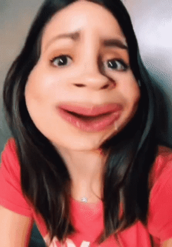 Woman in Red Shirt with M Making Funny Face
