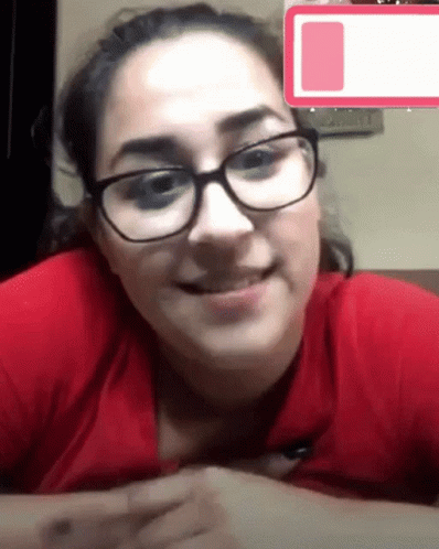 Woman in Red Shirt with Tired Sticker