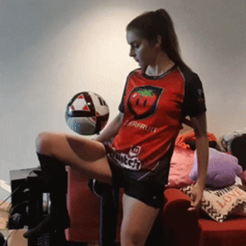 Woman In Red Shirt With Tomato Squatting GIF