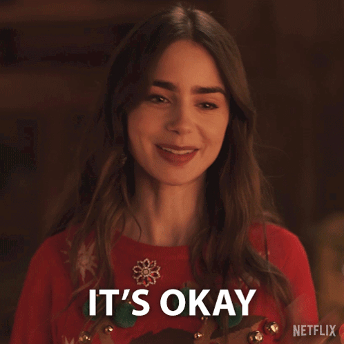 Woman in Red Sweater Smiling Saying It's Okay