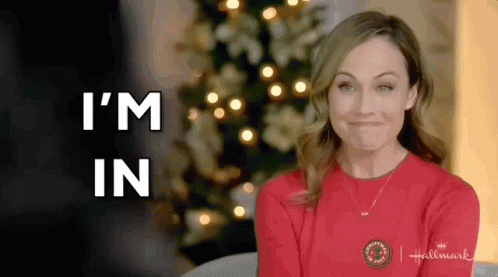 Woman in Red Sweater Smiling Says I'm In Christmas Tree