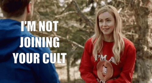 Woman in Red Sweater Talking to Man in Blue