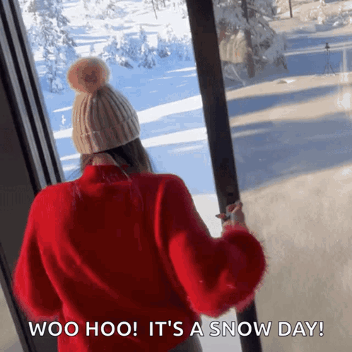 Woman in Red Sweater Watching Snow Day