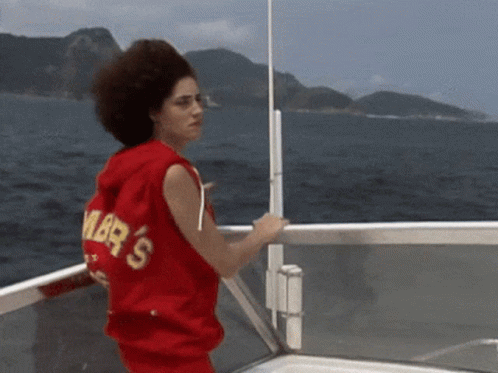 Woman In Red Sweater With Amber's On Boat GIF