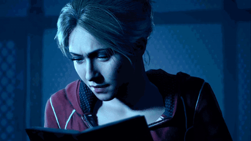 Woman In Red Sweatshirt Reading Book GIF