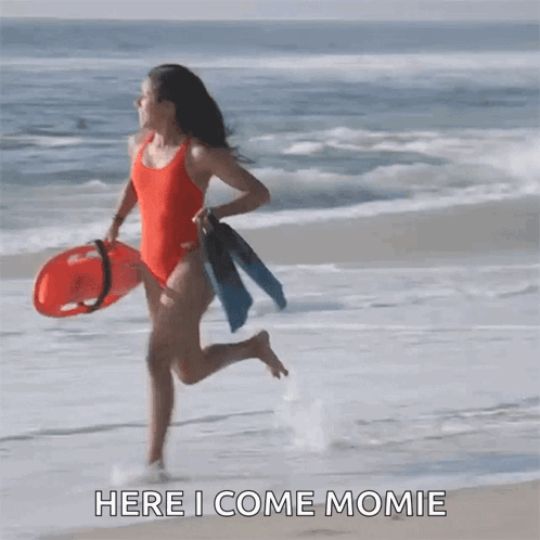 Woman in Red Swimsuit Runs with Life Preserver and Flippers