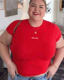 Woman in Red T-Shirt and Jeans Smiling