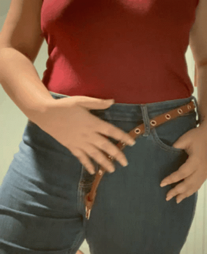 Woman In Red Tank Top And Blue Jeans GIF