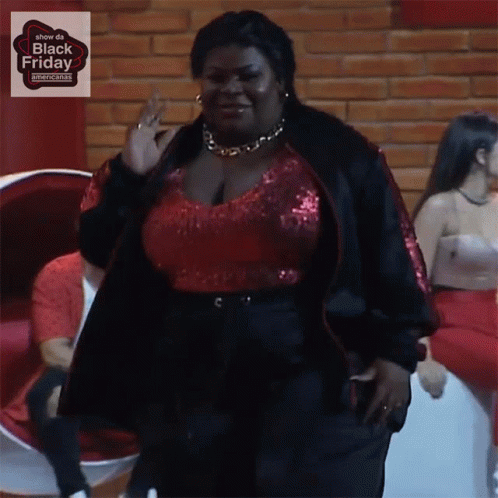 Woman in Red Top and Black Jacket Black Friday Sign