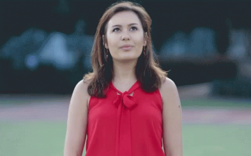 Woman in Red Top Looking Up