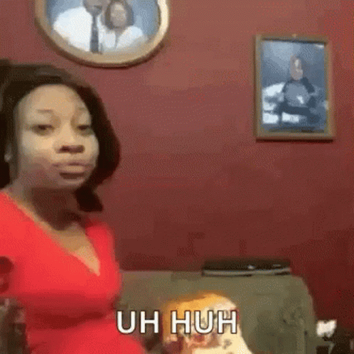 Woman in Red Top on Couch Saying Uh Huh