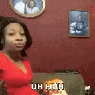 Woman In Red Top Saying Uh Huh GIF