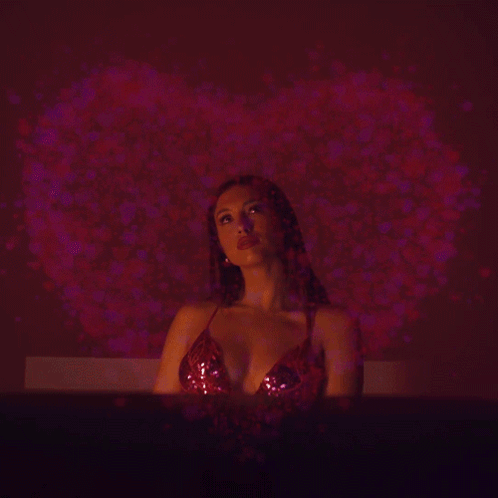 Woman in Red Top with Heart Projection
