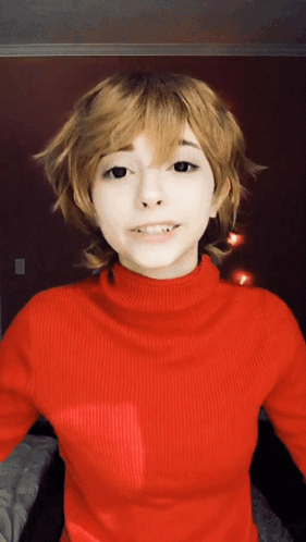 Woman in Red Turtleneck and Blonde Wig