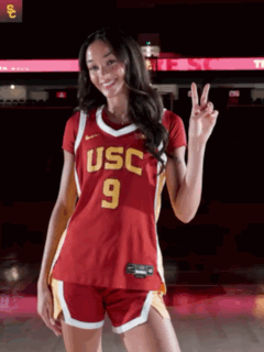 Woman in Red USC Jersey and Shorts