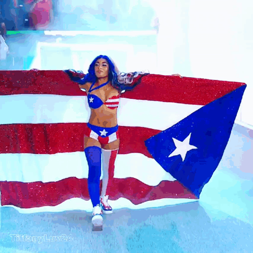 Woman in Red White and Blue Holding Puerto Rico Flag