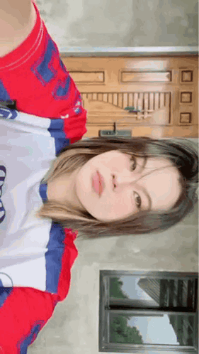 Woman In Red White Blue Shirt By Door GIF