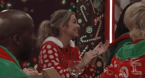 Woman In Red-White Polka Dot Sweater With Wine GIF