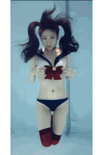 Woman in Sailor Suit Underwater
