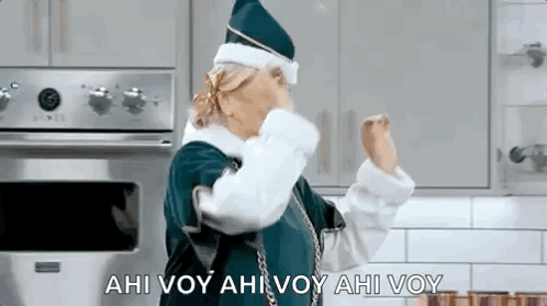Woman in Santa Costume Dancing With Hands Up
