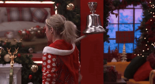 Woman In Santa Outfit And Bell GIF
