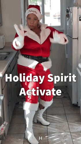Woman in Santa Outfit Dancing in Kitchen With Holiday Spirit Activate