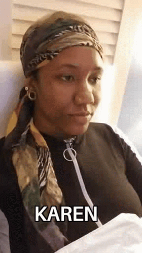 Woman in Scarf, Headband, and Bandana Sitting in Chair