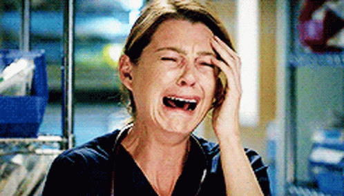 Woman in Scrub Top Crying
