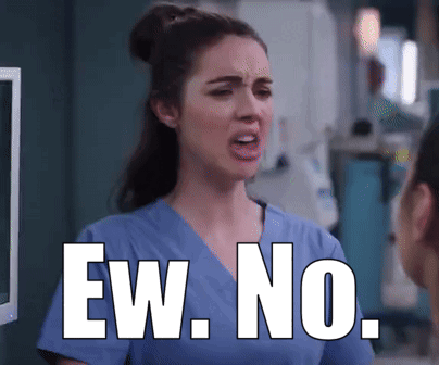 Woman in Scrubs Saying Ew No in Front of Monitor