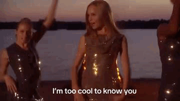 Woman In Sequined Dress Dancing On Beach GIF