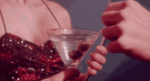 Woman In Sequined Dress Holding Martini GIF