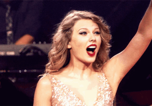 Woman in Sequined Dress Raising Arm