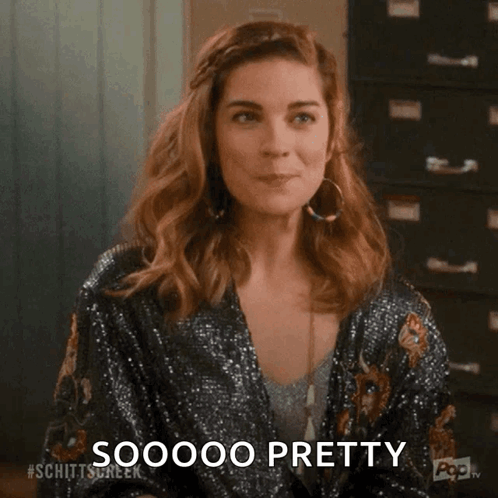 Woman In Sequined Jacket Making Funny Face GIF