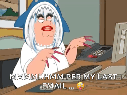 Woman in Shark Costume Sitting at Desk With Computer