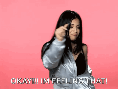 Woman In Silver Jacket Says Okay I'm Feeling That GIF