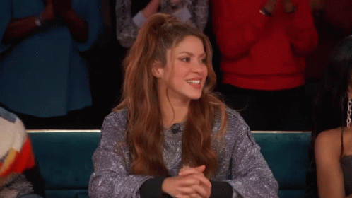 Woman In Silver Sweater Clapping In Crowd GIF
