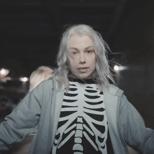 Woman in Skeleton Shirt and Blue Hoodie
