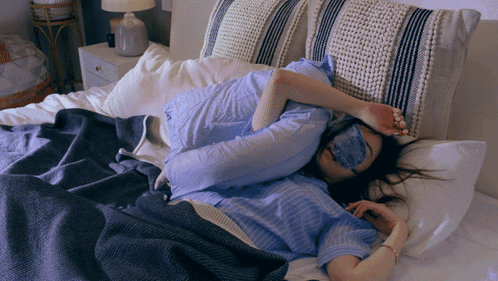Woman in Sleep Mask Lying in Bed