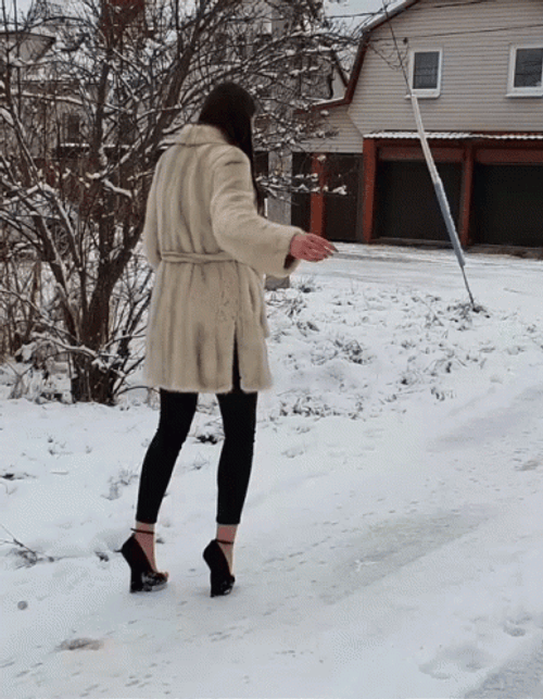 Woman In Snow Slipping On Ice Mishap GIF