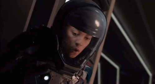 Woman in Space Suit and Helmet