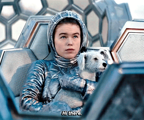 Woman In Space Suit Holding Dog Says Hi There GIF