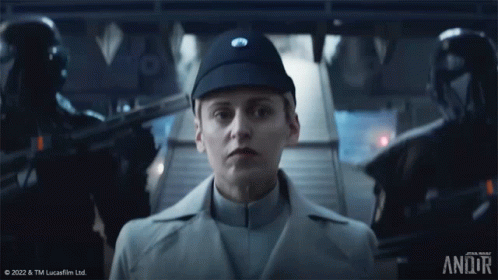 Woman In Star Wars Uniform Standing In Front Of Staircase